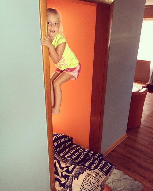 Anna climbing the door frames while we work